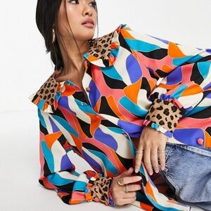 Never Fully Dressed blouse with a multi-colored abstract print and a leopard-pri